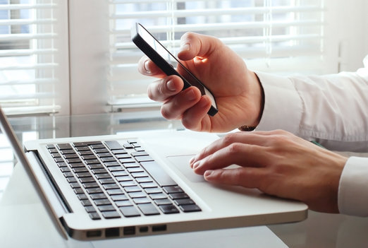 business man using smart phone in the office