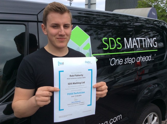 Rob Flaherty proudly displaying his FESSI certificate